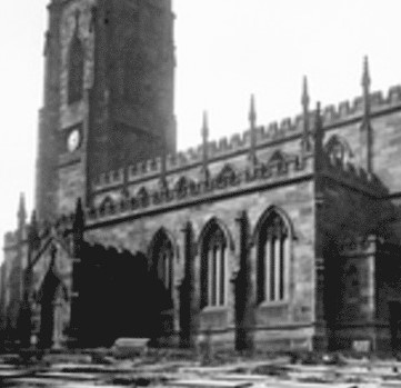 Victorian church with headstones crammed in the foreground.